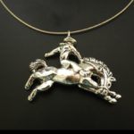 Cowboy on Bucking Bronco Necklace in White or Gold Bronze